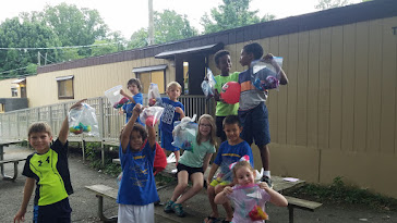 Kids holding tie-dye bags