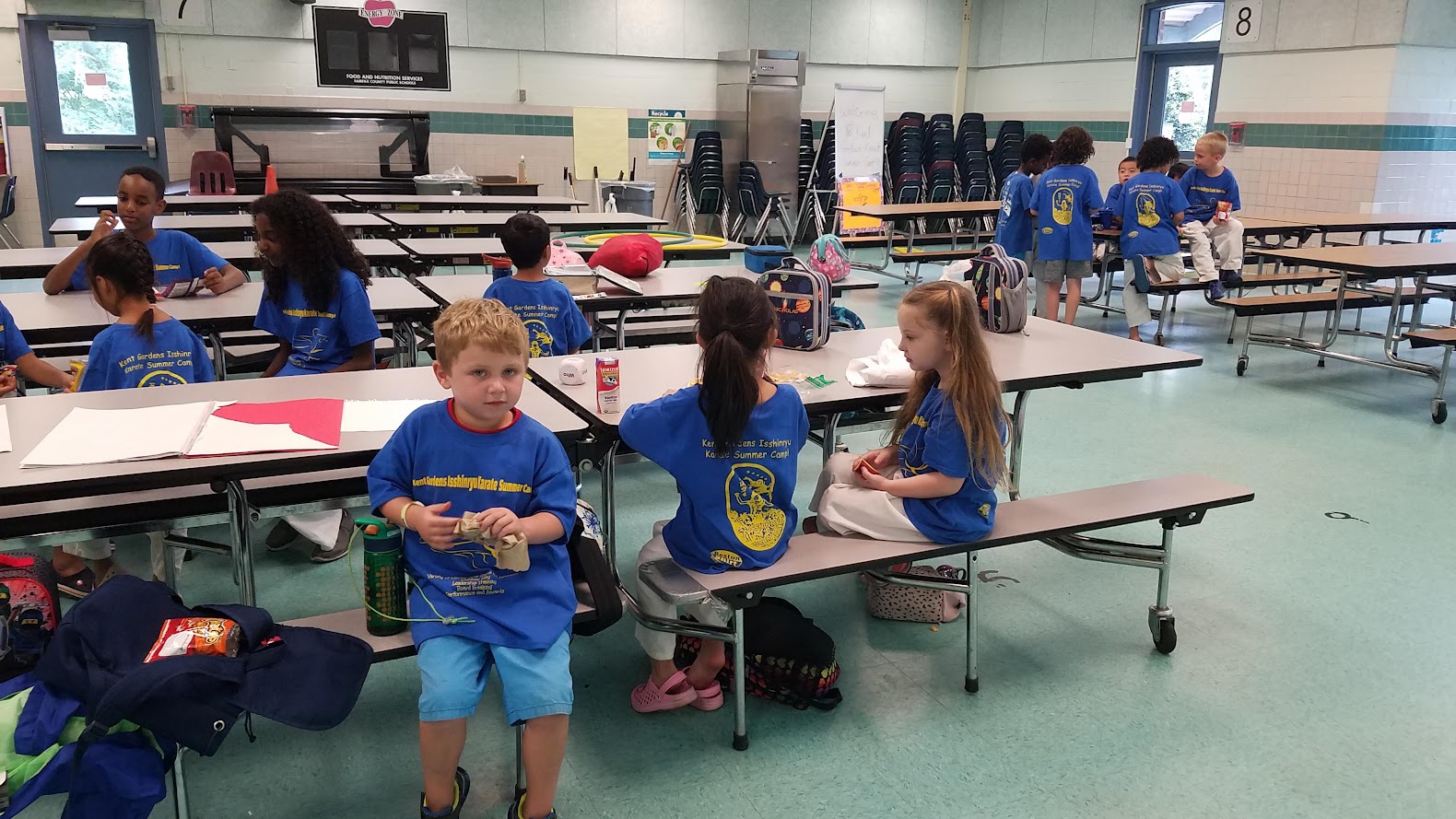 Snack time in cafeteria blue shirts