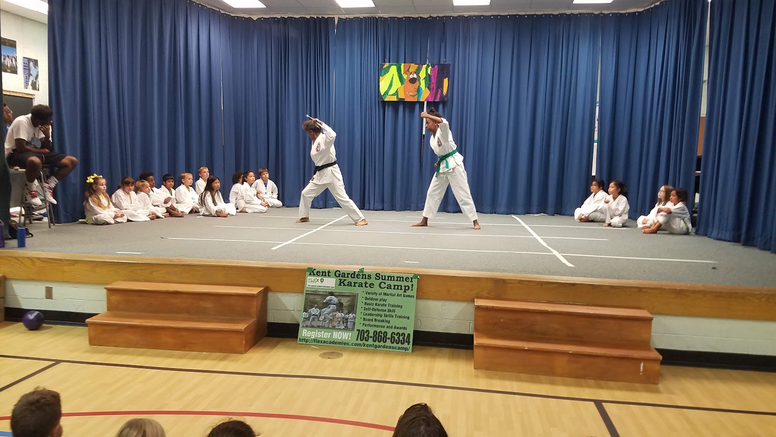 Two students sparring on stage