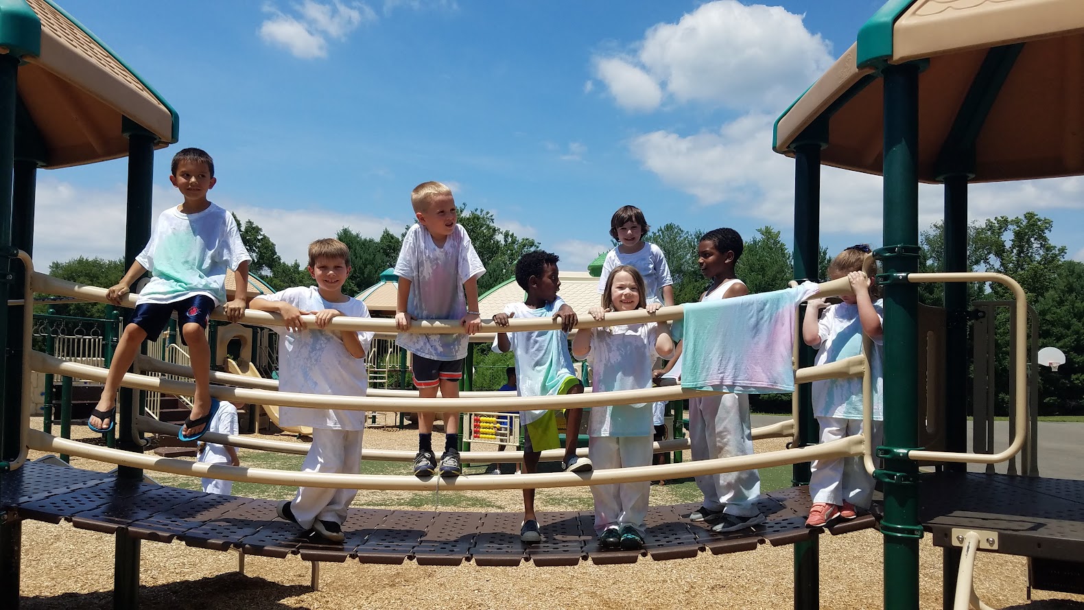 Tie-dye shirts at playground structure