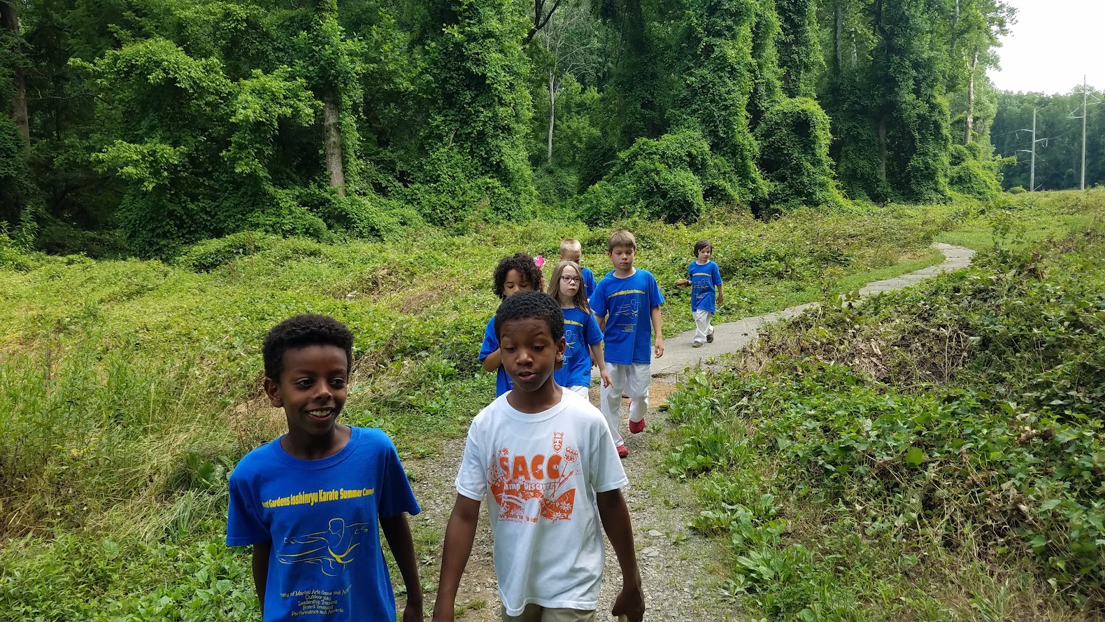 Campers hiking on nature trail