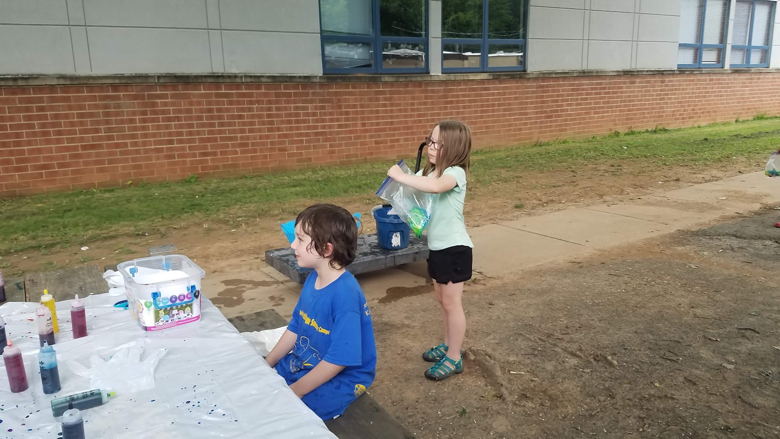 Two campers at tie-dye table