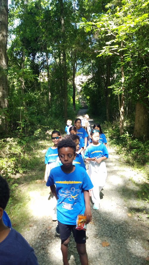 Campers walking on nature trail