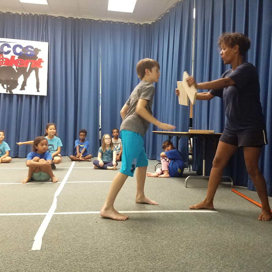 Board breaking practice with instructor