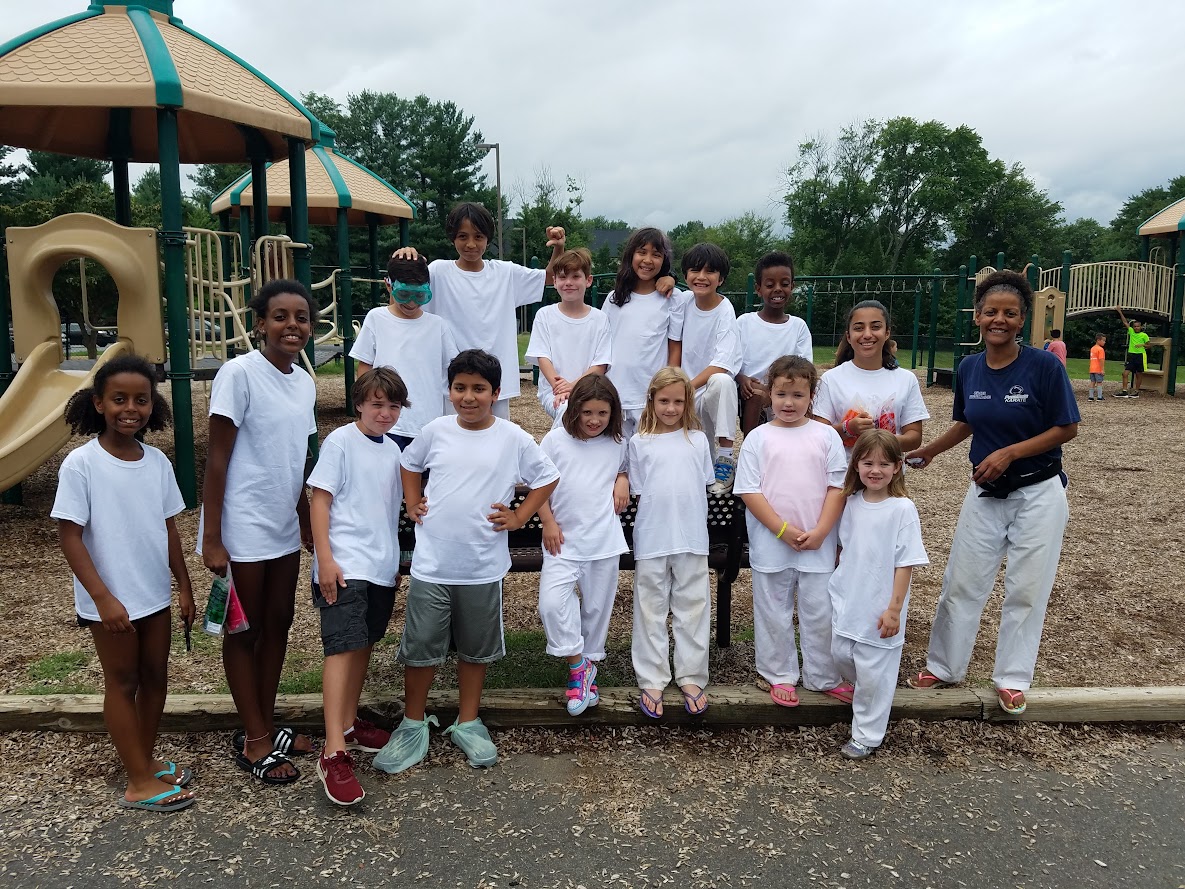 Camp group photo at playground with Sensei